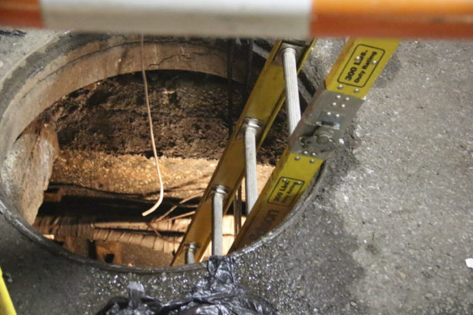 Street Manhole at night.