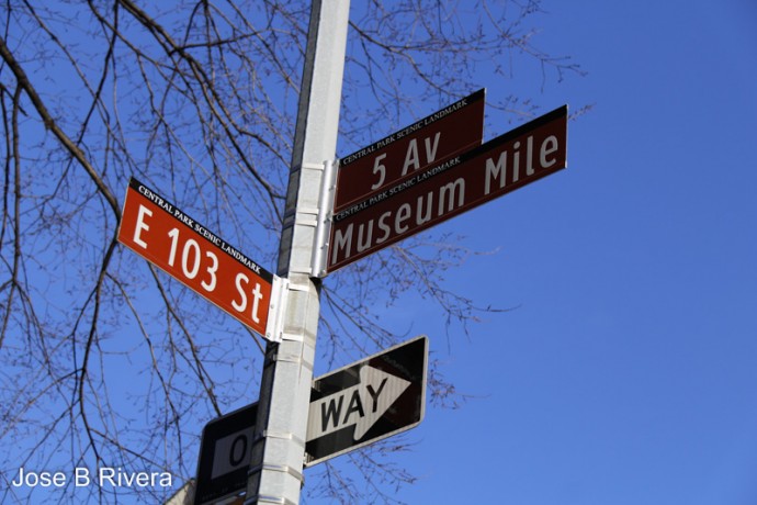 Street sign on Fifth Avenue at East 103rd Street.