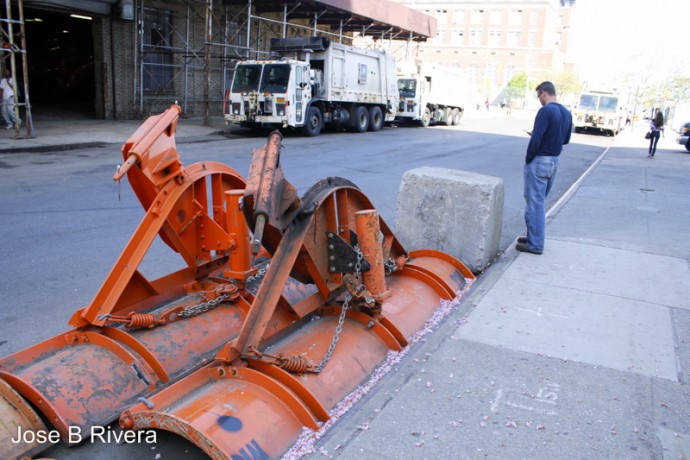 Gentleman stands near what Metropolitan Hospital Workers call 'The Rock'. This is where they sit to have a smoke break. Taken at 99th Street between First and Second Avenues.