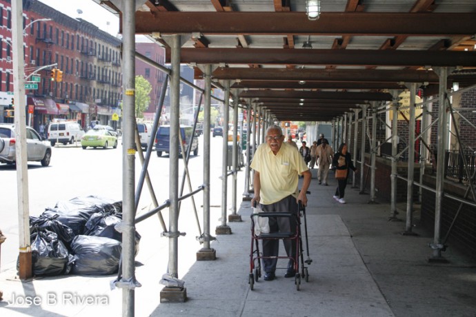 Photo of my dad, using his walker to go to the bank.