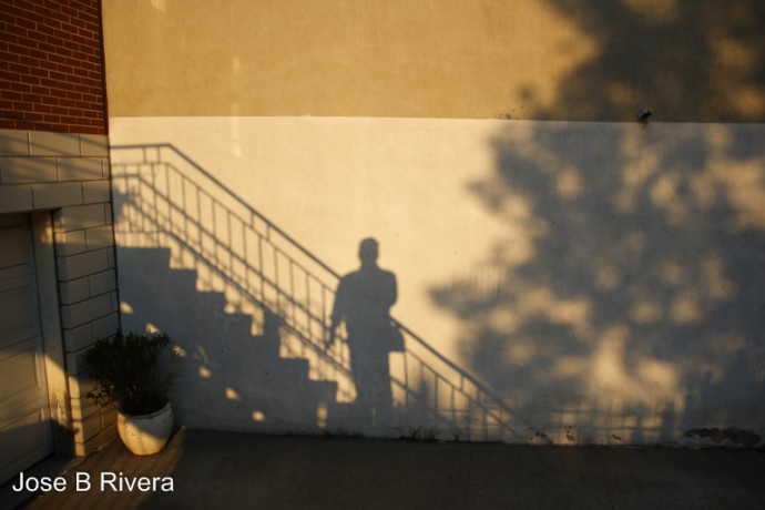 My shadow against building next to my apartment building.