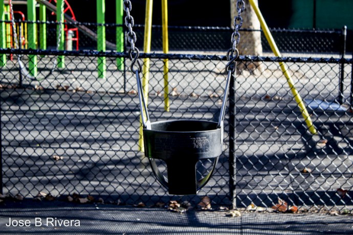 Empty child swing. These are made of rubber and go up to a child's waste.