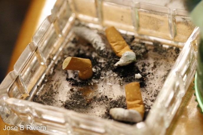 Ash Tray with three cigarette butts.