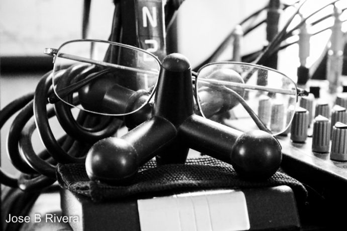 Eye glasses on giant Jax on top of the base of my microphone.