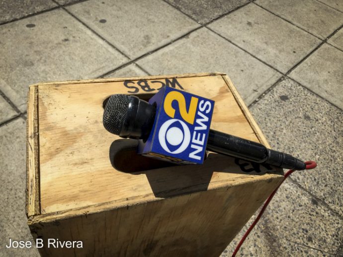 Media microphone on wooden box . Taken across the street from Manhattan Courthouse near City Hall.