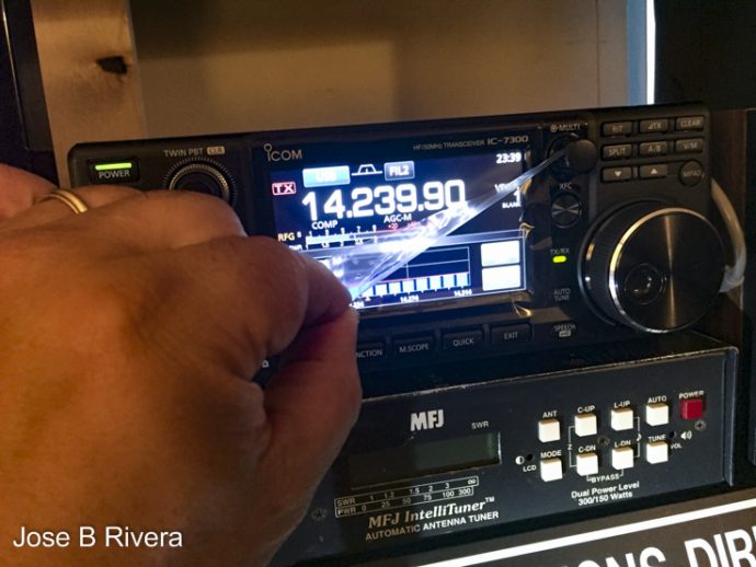 Peeling away protective plastic sheath on my new Icom IC-7300 Ham Radio.
