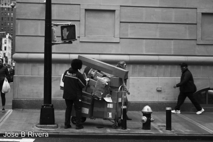 FedEx guy setting up packages.