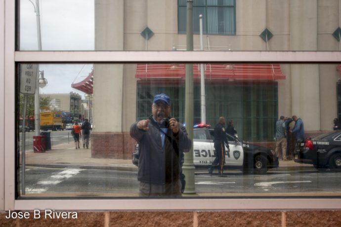 Reflections of me taking reflection of an arrest.