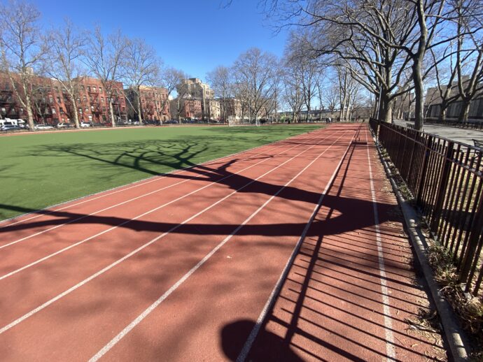 Photo of running track located at East 113-114th Street between 1st and Pleasant Avenues inside of Jefferson Park. It was a clear and cool day.