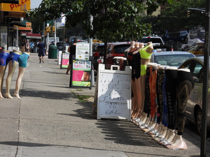 Manikins lined up in a row showing the latest pant wear on Eat 109th Street and Third Avenue