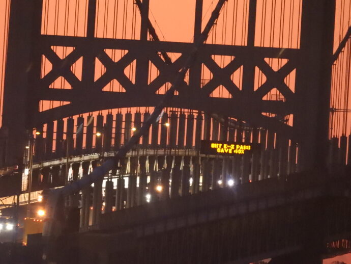 The Sun rises behind the Triboro Bridged showing these beautiful background colors.