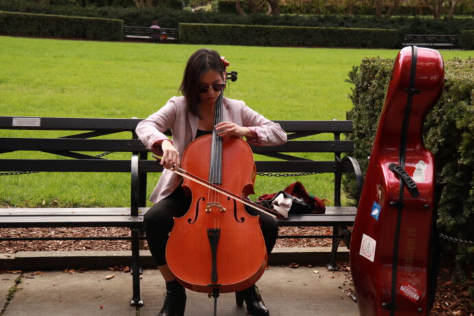 Pretty Lady Violinist in Central Park Conservatory Garden